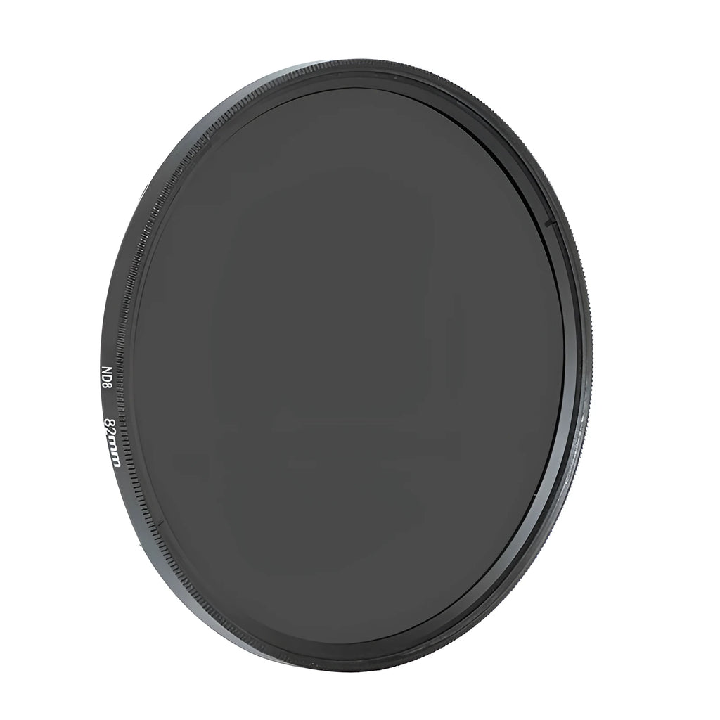 ND8 neutral density camera filter with aviation aluminium frame shown next to a lens.