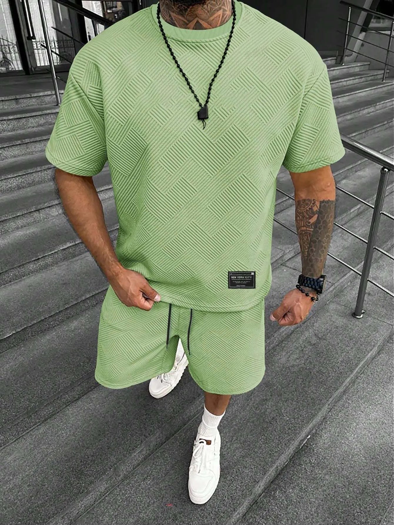 Men's short sleeve top and shorts suit in a polyester blend fabric on a mannequin