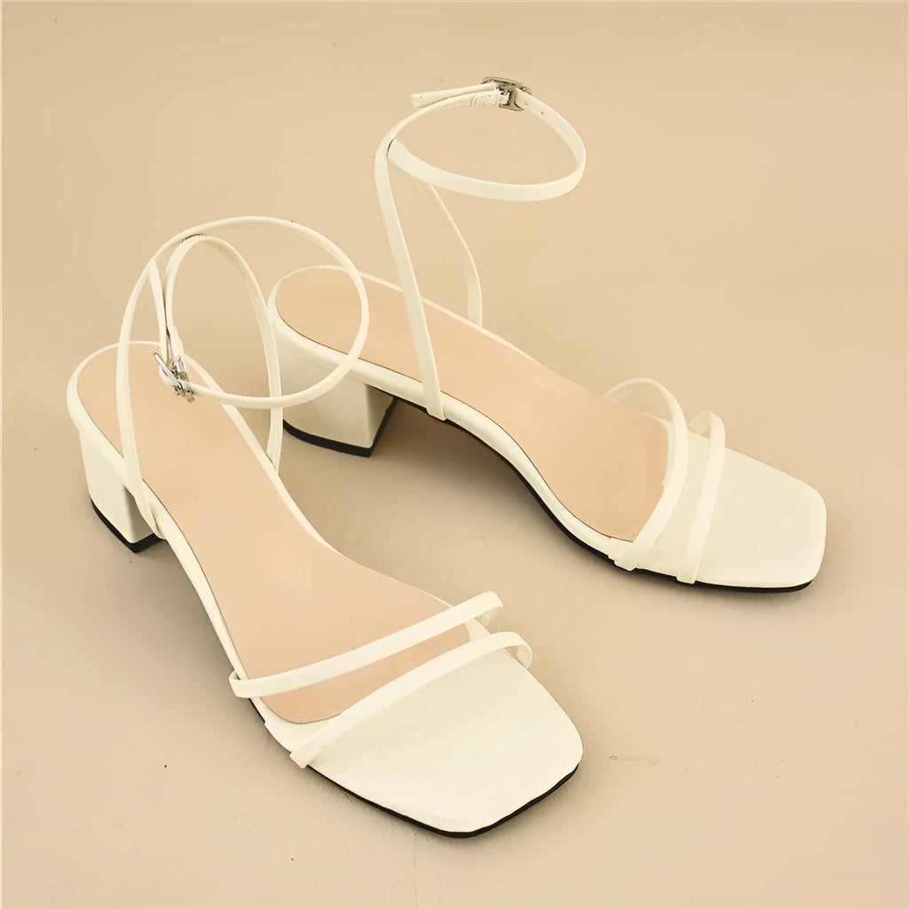 Beige women's stiletto sandals with chunky block heel and square toe design, showing adjustable ankle buckle closure