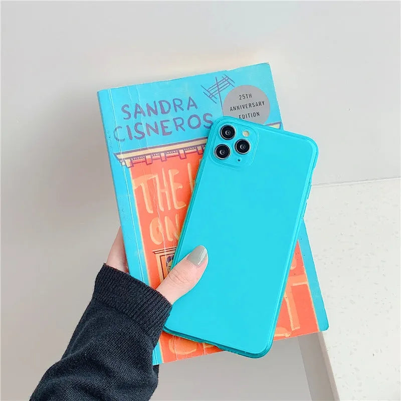 Transparent fluorescent TPU phone case in orange for iPhone 15 Pro Max showing slim back cover design