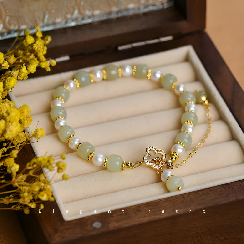 Women's Hetian jade bracelet with round pearl pendant and gold electroplated metal links