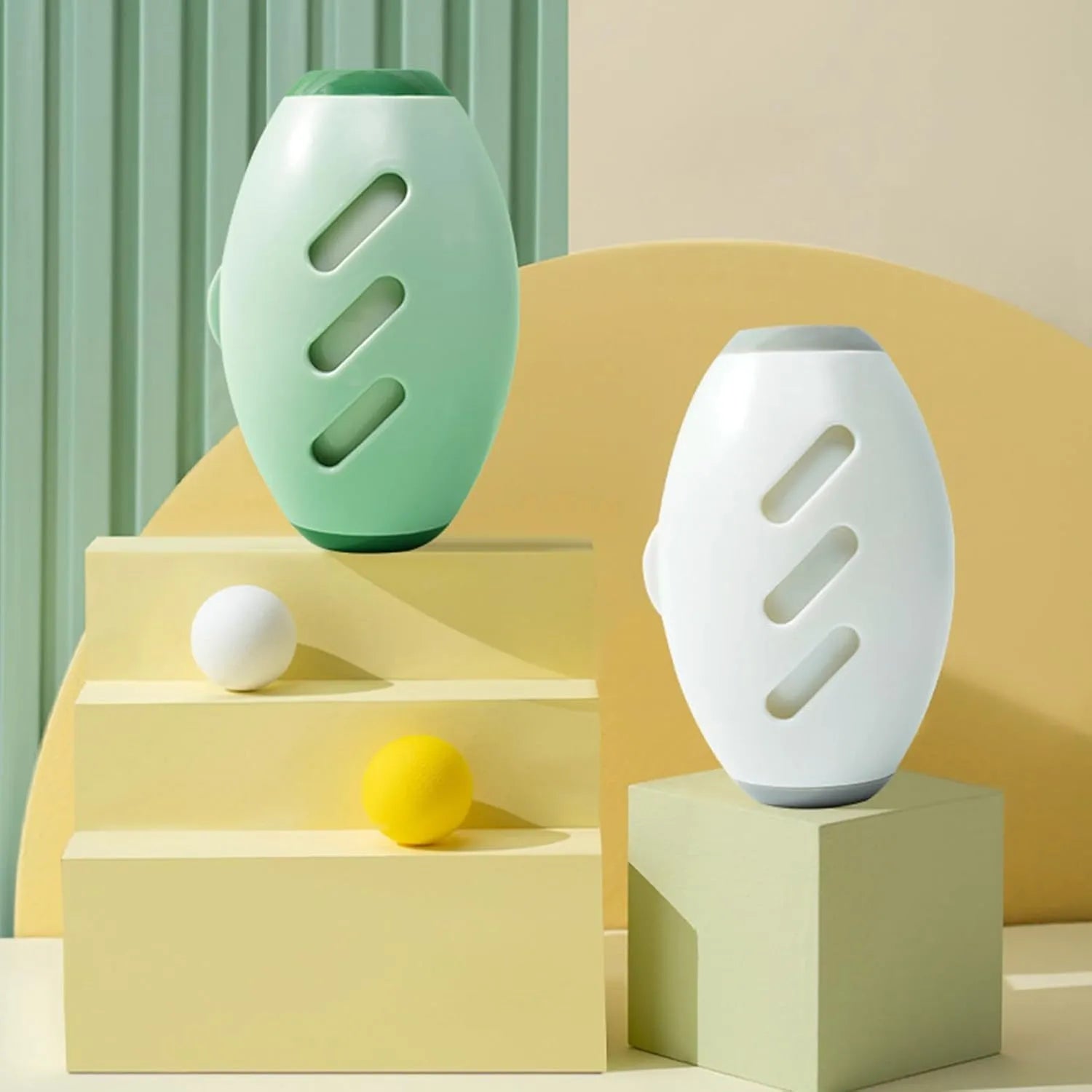 Green and white washable reusable gel lint roller balls for portable pet hair removal.
