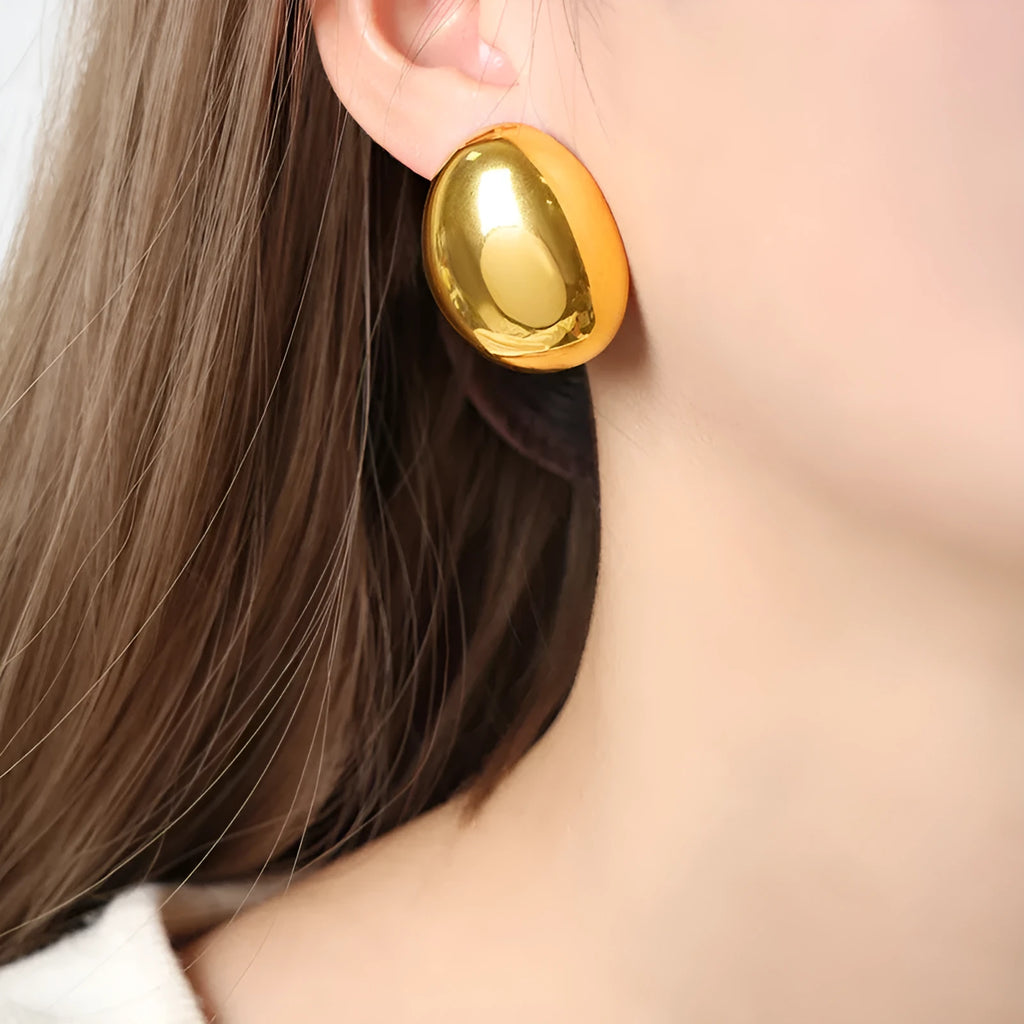 Geometric stainless steel ear studs with electroplated 18K gold finish and glazed surface in colour DFE139