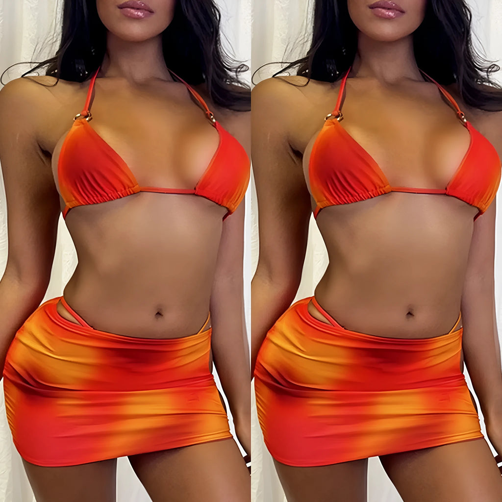 Tie-dye solid colour three-piece halter bikini swimsuit set with skirt on a mannequin.