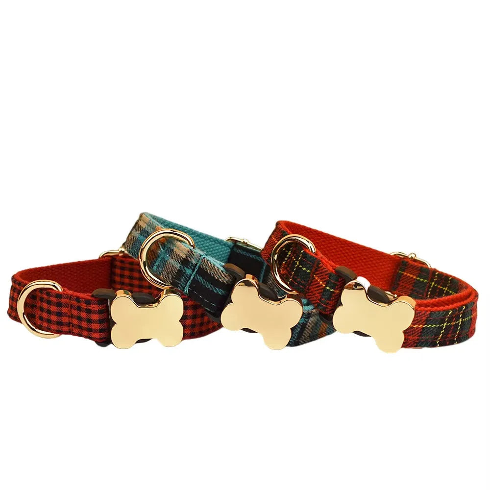 Flat printed grid nylon dog collar with a white bone-shaped plastic buckle on a green background.