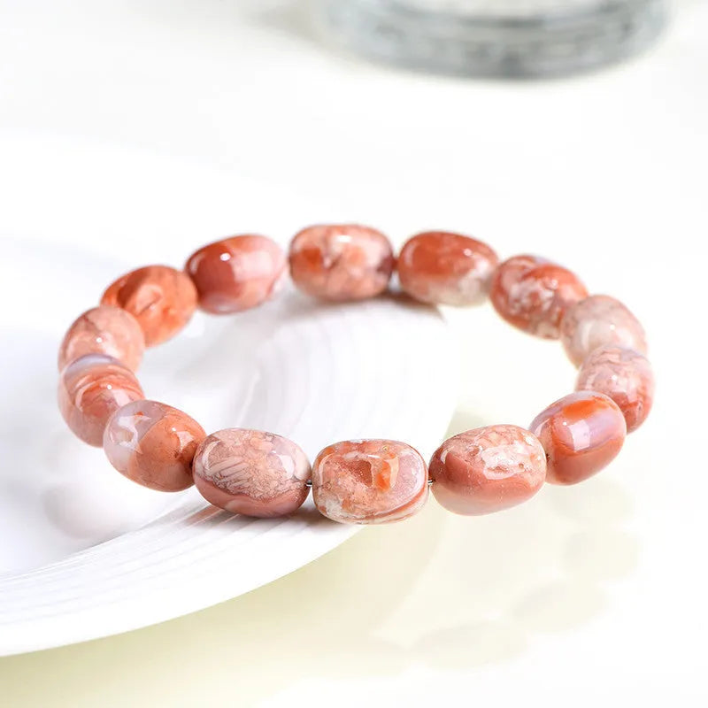 Natural cherry agate barrel bead bracelet with 10x14mm stones and Ruyi design elements