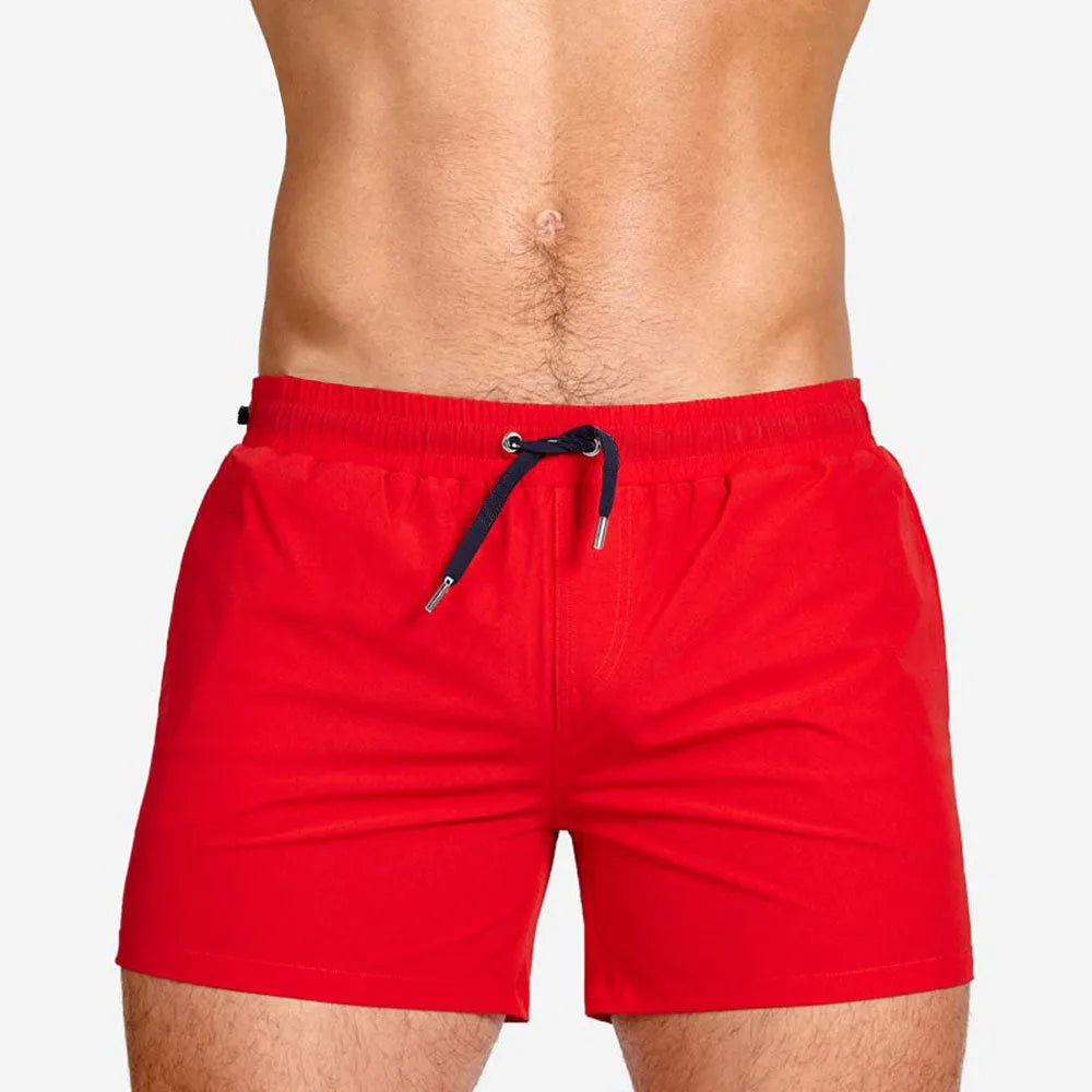 Mesh-lined sports shorts in polyester fabric showing colour options