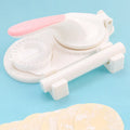 3 In 1 plastic dumpling maker with rolling pin and moulds, green colour, on kitchen countertop