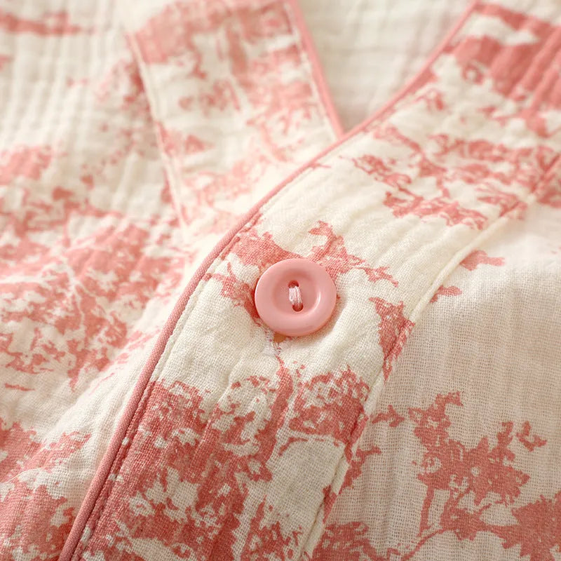 Women's pink pure cotton gauze lounge suit with lace-up detail and long sleeves, shown with matching trousers