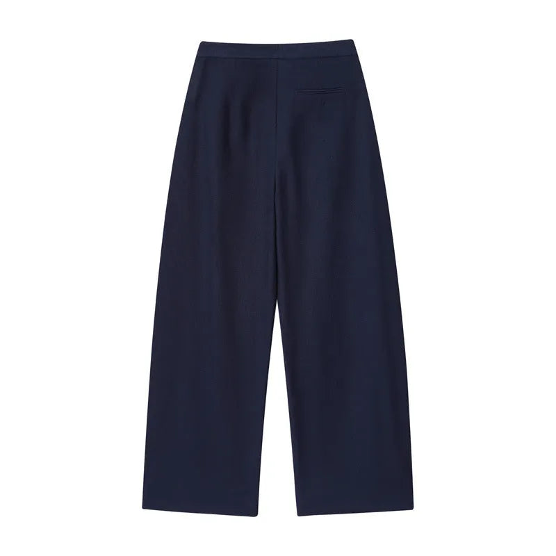 Women's linen blend co-ord set featuring a blouse with flounced sleeves and matching wide leg trousers.