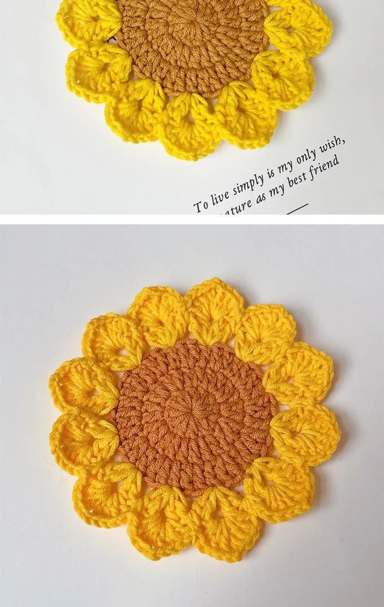 Hand-woven wool coaster with floral pattern on a wooden table.