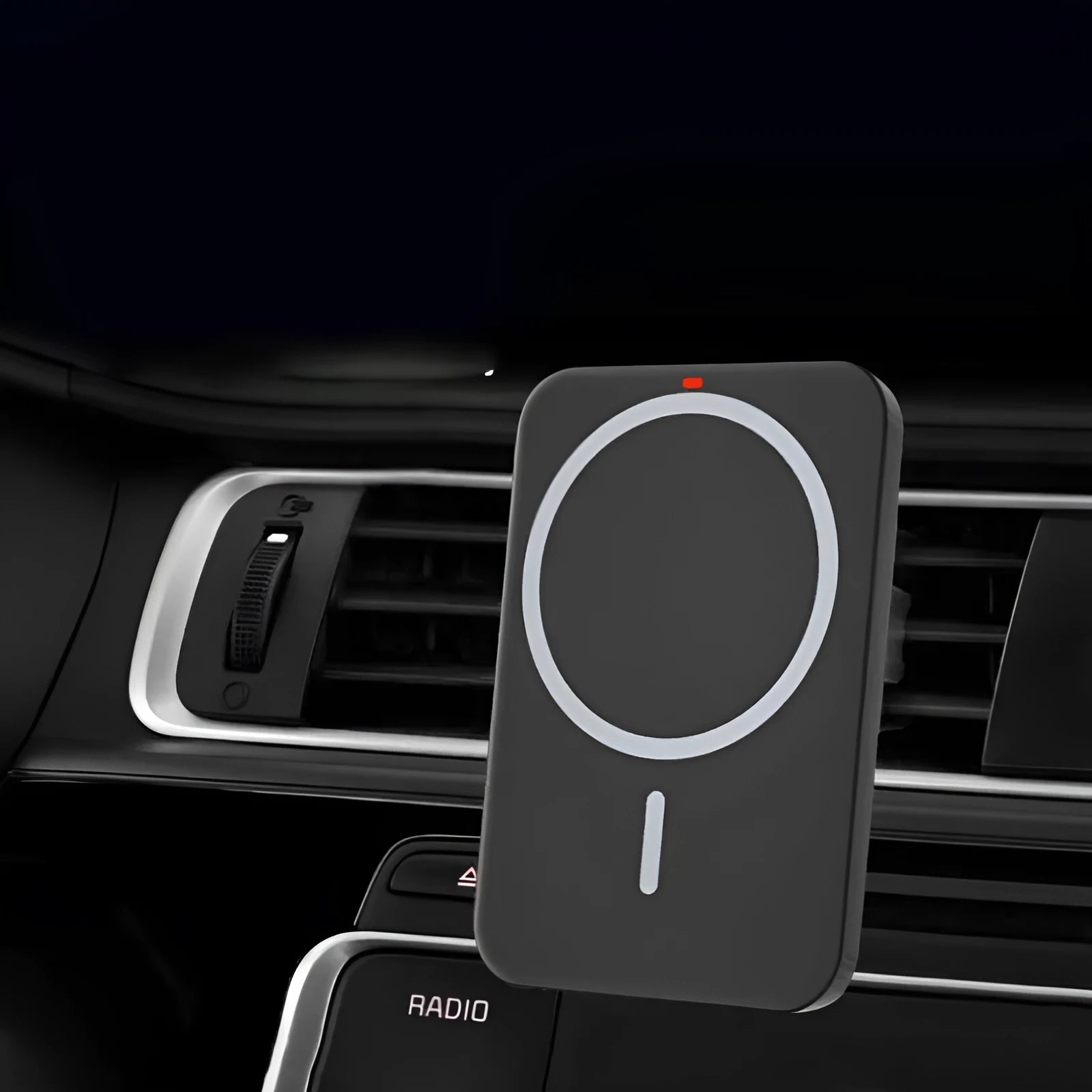 Black car magnetic wireless phone charger and bracket mounted on a car air vent.