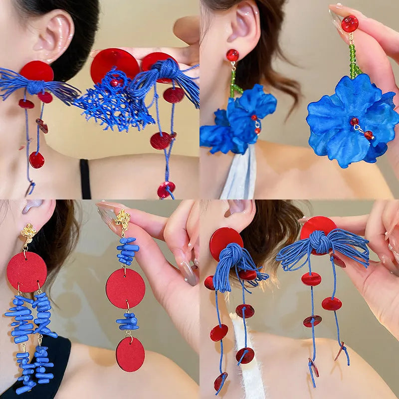 Women's geometric fabric earrings with blue resin flowers on round silver needle cloth base