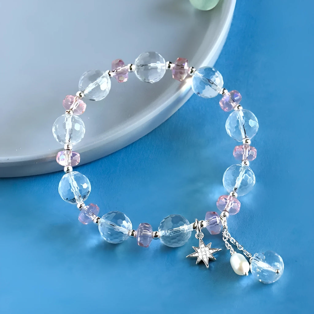 Women's white crystal bracelet with diamond-shaped beads and lucky cat charm