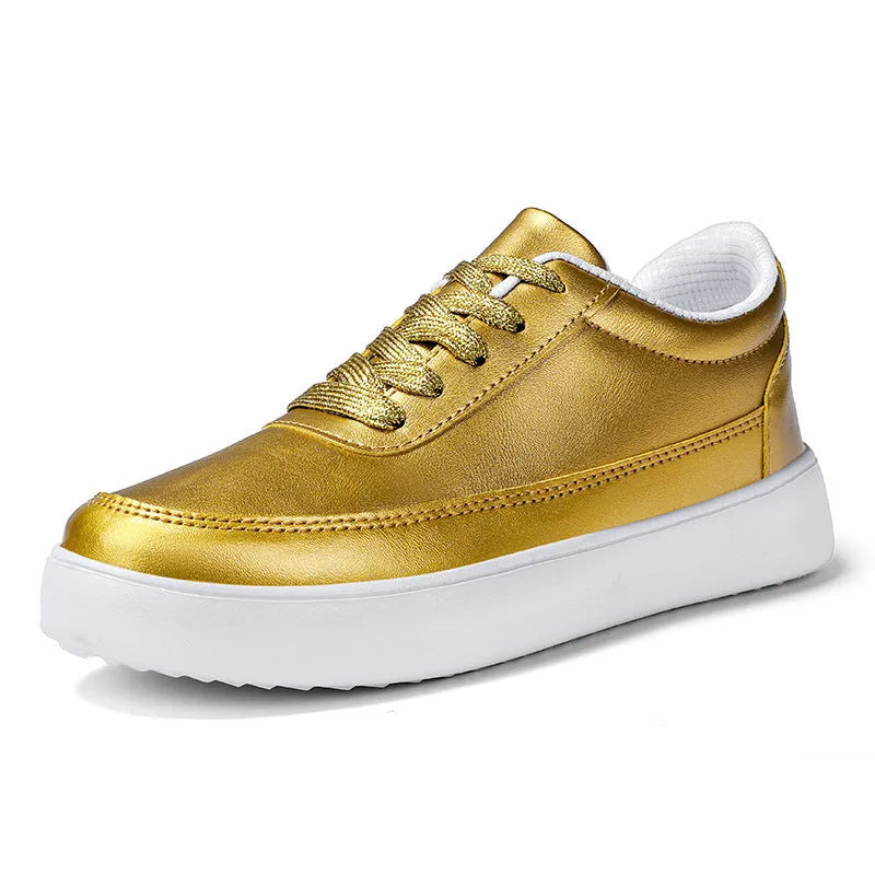 Women's white leather flat casual shoes with front lace-up design on a neutral background.
