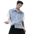 Blue and white gradient short-sleeved loose fit shirt on a hanger.