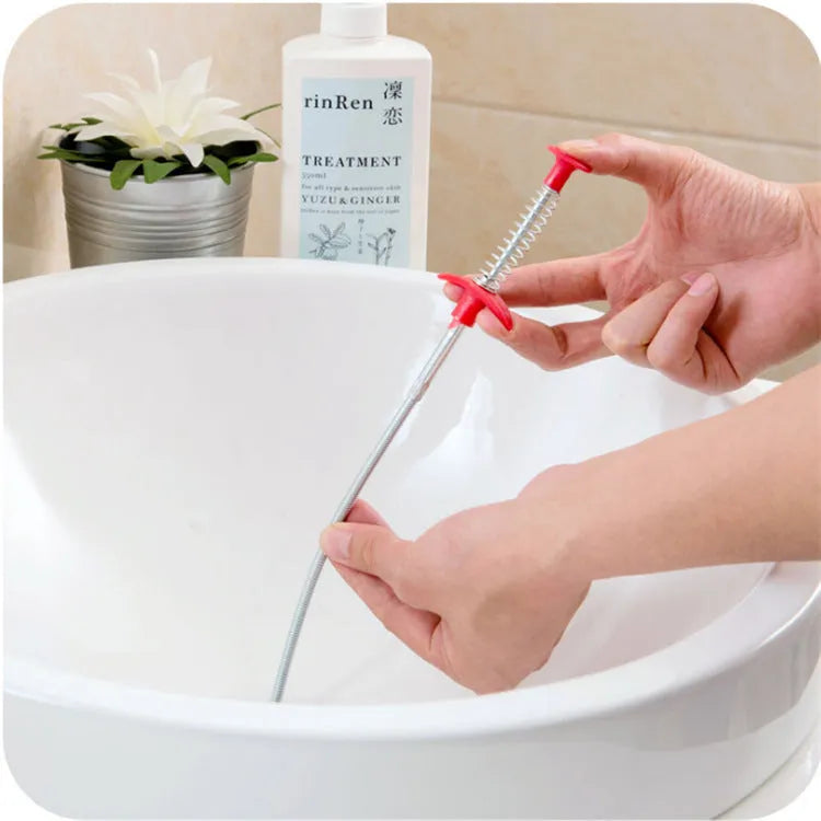 Flexible plastic and stainless steel drain cleaning spring tool with rubber grip for household pipe maintenance