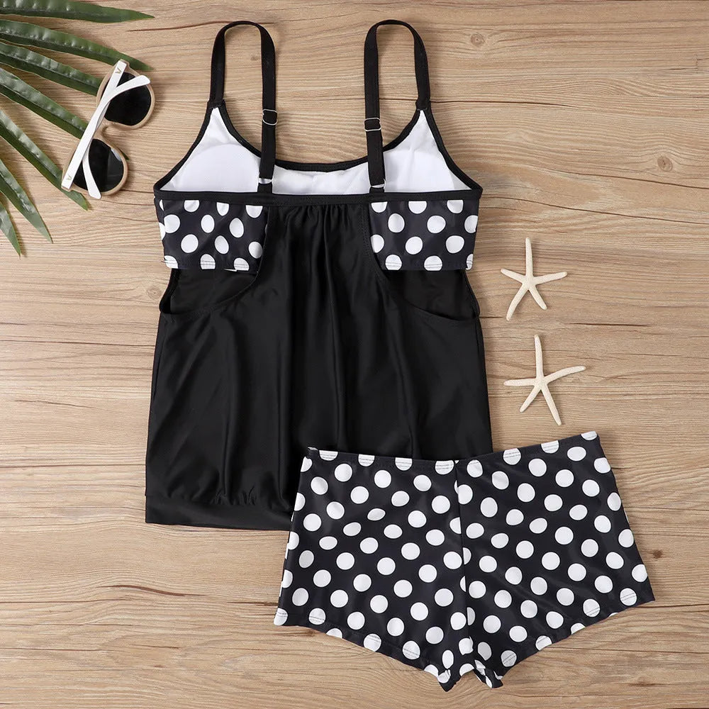 Women's black polka dot high-waist boxer swimsuit top and pants set on a mannequin.