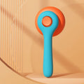 Blue and white self-cleaning pet grooming brush for removing tangled hair and loose fur from cats and dogs.