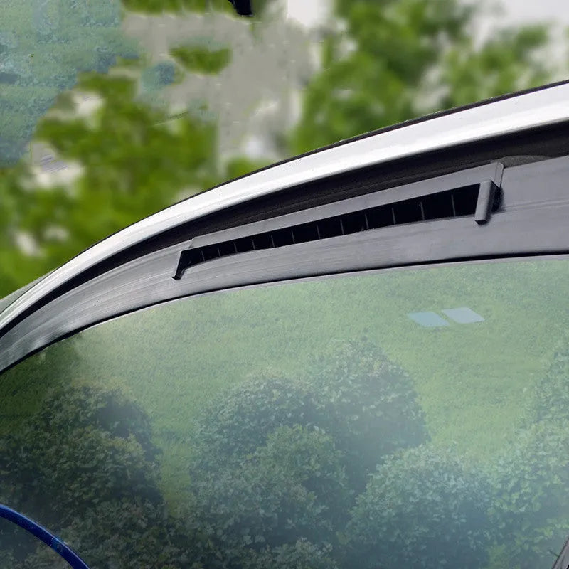 Black and white car ventilation fan with USB cable for vehicle heat and odour management
