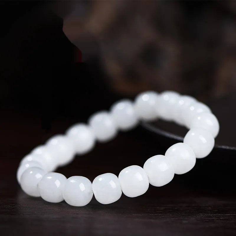 White jade barrel bead bracelet showing Hetian jade construction with traditional barrel beads