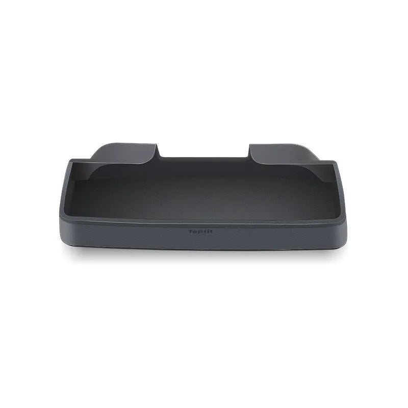 Black silicone sunglasses case mounted in a Tesla Model 3 or Y centre console.