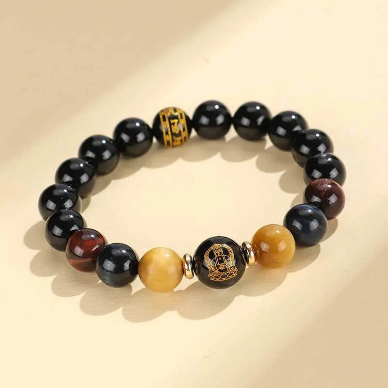 Manually crafted black agate beaded bracelet with gold, blue, and red tiger eye stones, showing ethnic zodiac design.