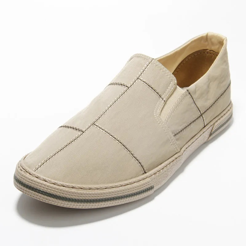Men's slip-on canvas shoes in multiple colours with vulcanised rubber soles and round toe design