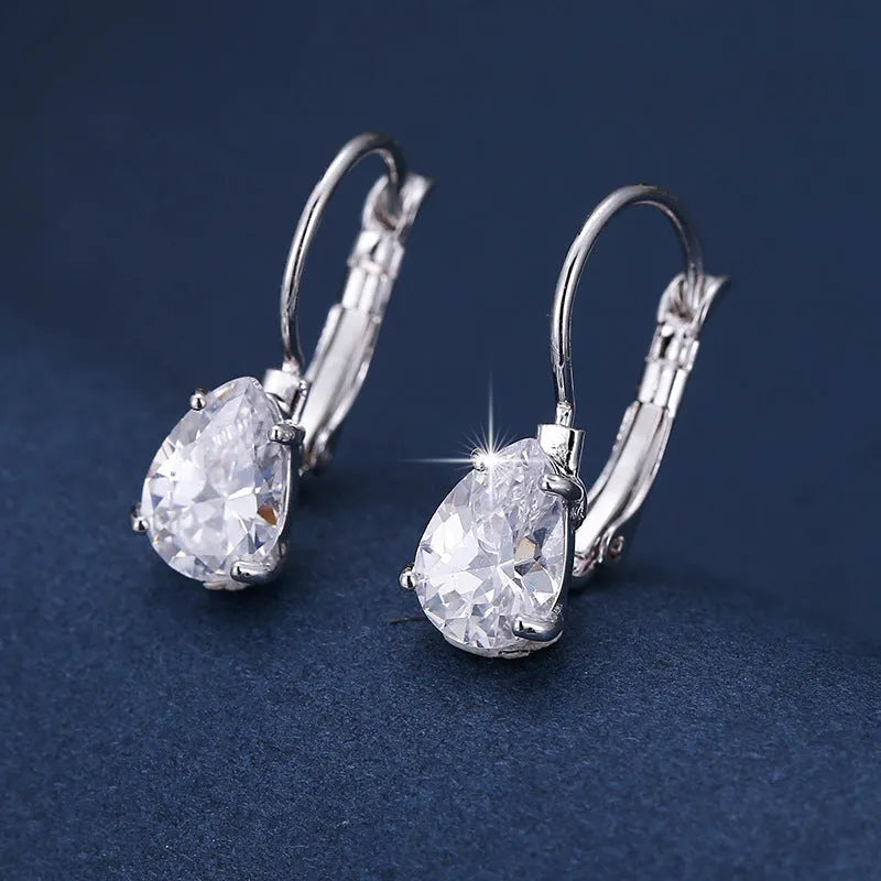 Gold and platinum drop-shaped women's metal earrings with a k-platinum inlaid gem