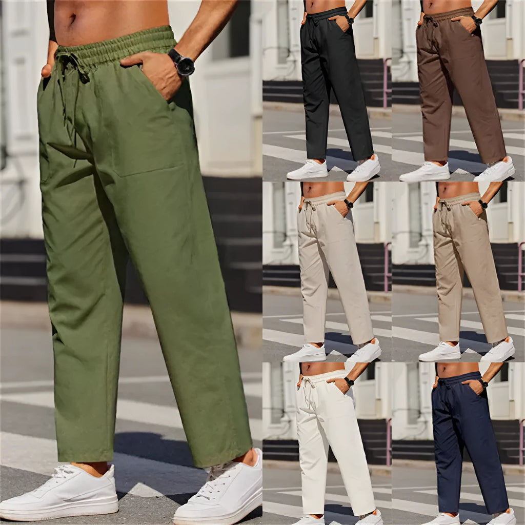 Man wearing straight-leg linen trousers in a solid colour with an elasticated waistband.