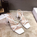 Women's white thick heel sandals with an 8cm high block heel and a backless slide-on design.