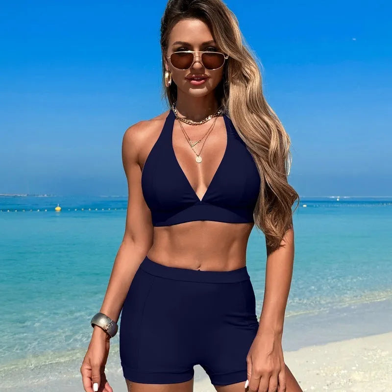 Women's black split bikini swimsuit with sleeveless design on a mannequin.