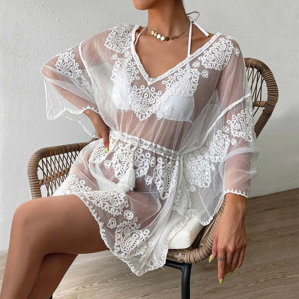 White women's beach blouse for swimming and sun protection with water soluble texture
