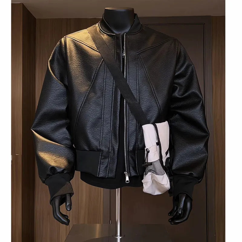 Men's black PU leather business jacket with extended length and slim-fit tailoring on hanger