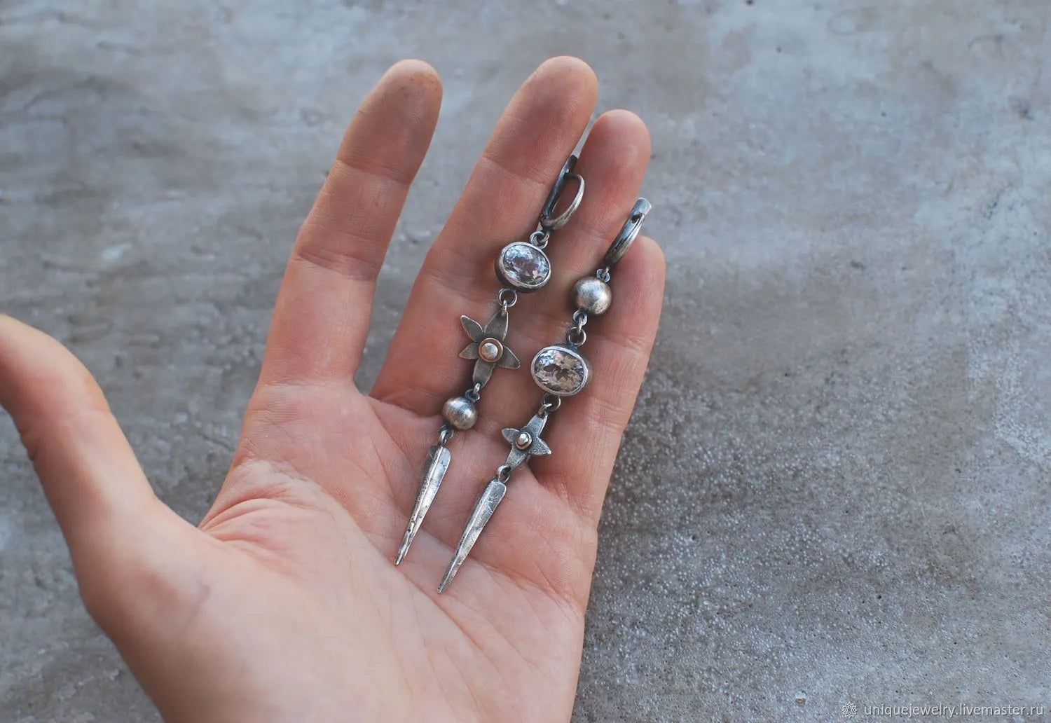 Geometric antique silver pendant earrings with rhinestone accents and long drop design