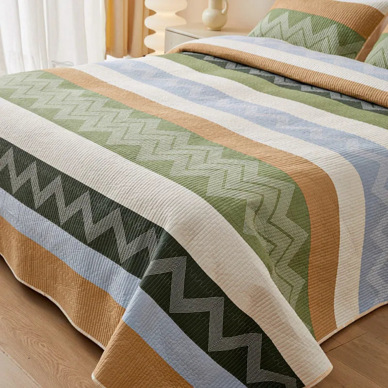 Pure cotton printed bed sheet set in a modern design on a bed, showing bedspread-style drape.