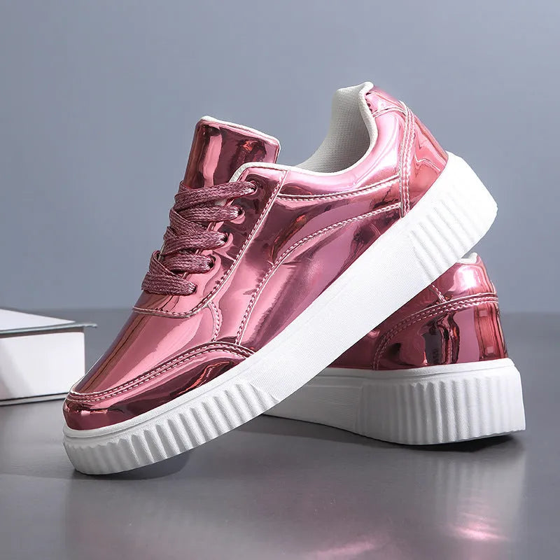 Rose gold sequin platform sneakers with round toe and thick sole.