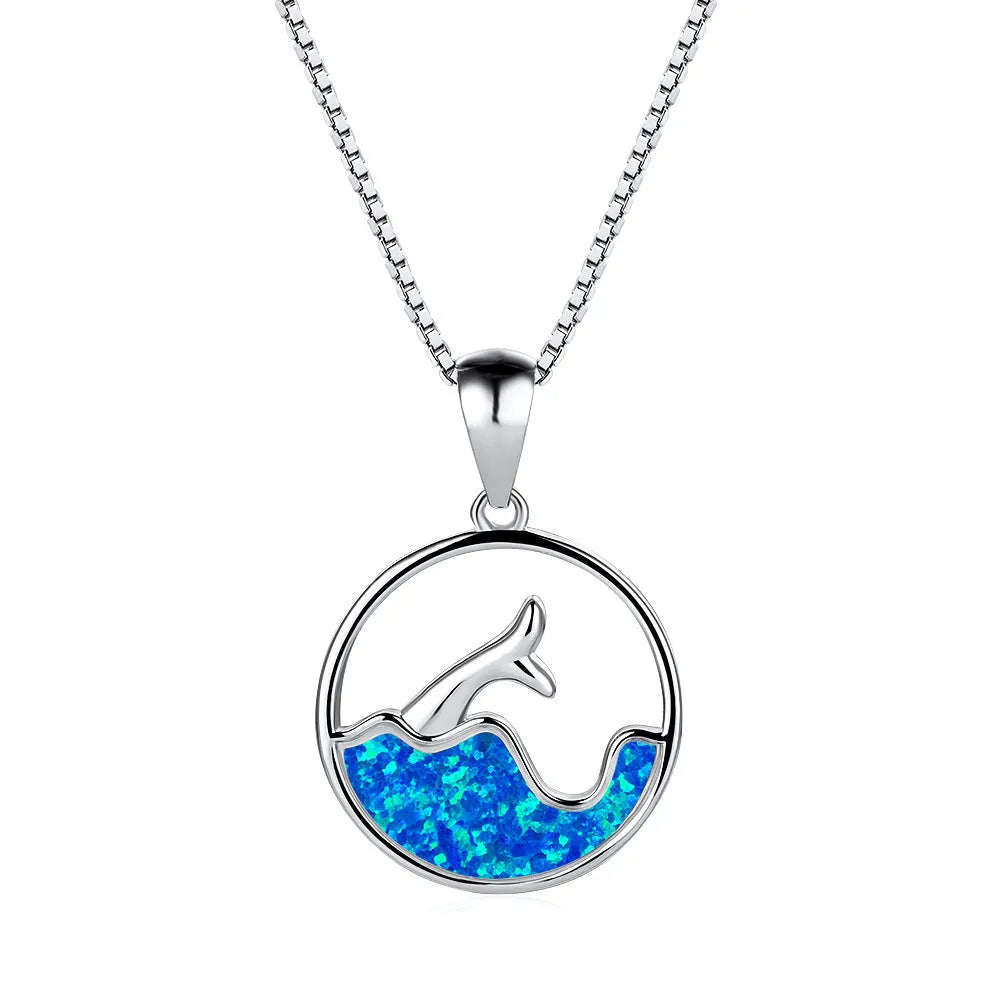 White gold plated fishtail pendant necklace with round blue opal stone on a 45 cm chain.
