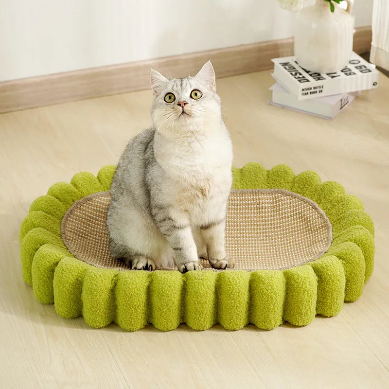 Green oval cat scratch pad bowl bed with sisal scratching surface measuring 650mm by 420mm