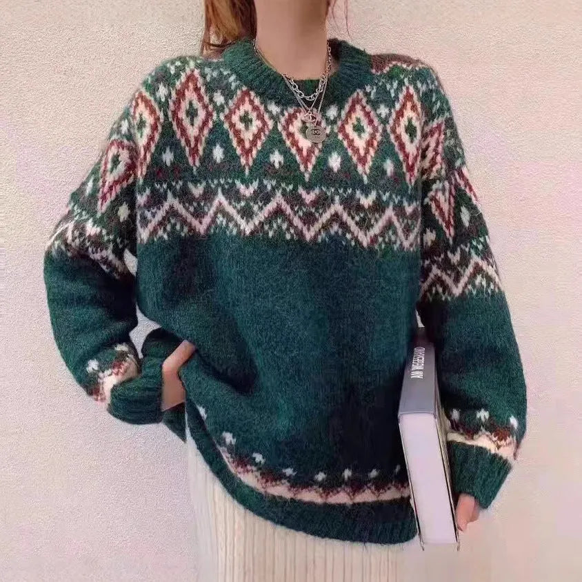 Red and white striped loose-fit long sleeve pullover knitted top on a hanger.