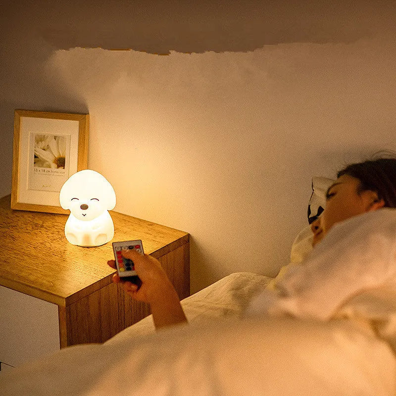 White LED puppy night light with silicone shade on a table in a corridor for soft glow