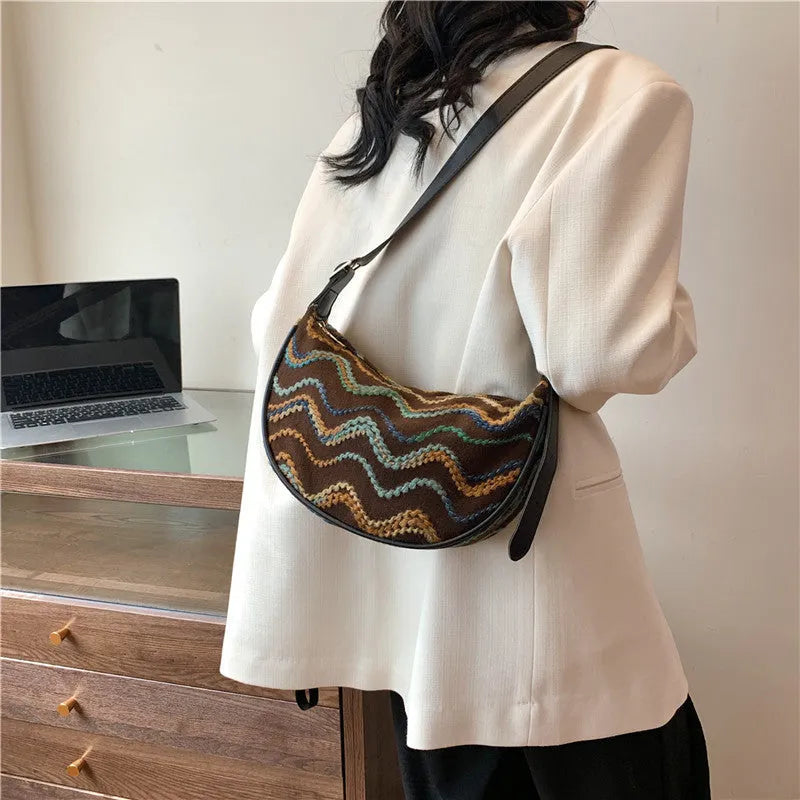 Women's straw woven crossbody bag with internal phone pocket and document compartment in corrugated brown