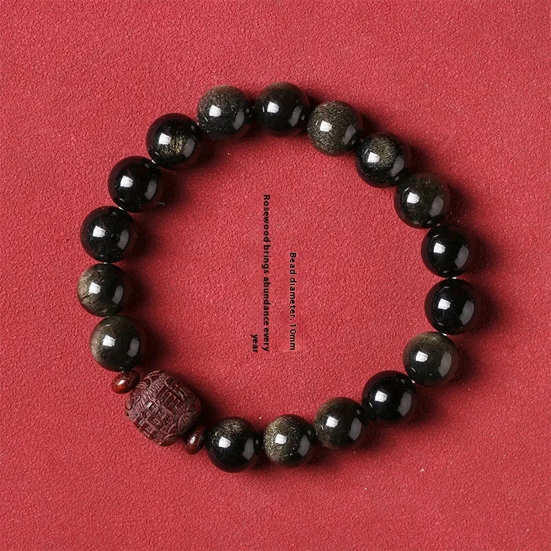 Golden obsidian vintage bracelet with hand-woven construction and national style design elements