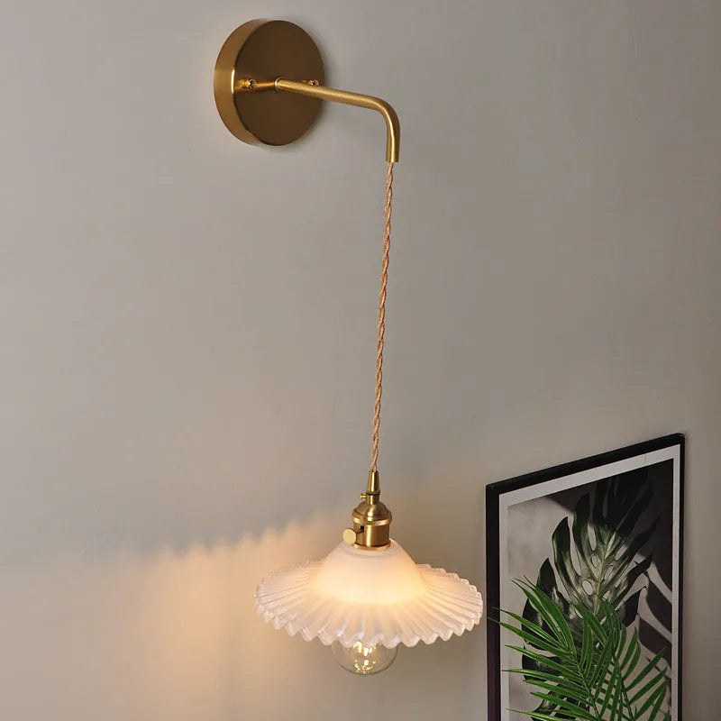Retro brass copper wall lamp with a transparent glass lotus shade in a choice of six colours.
