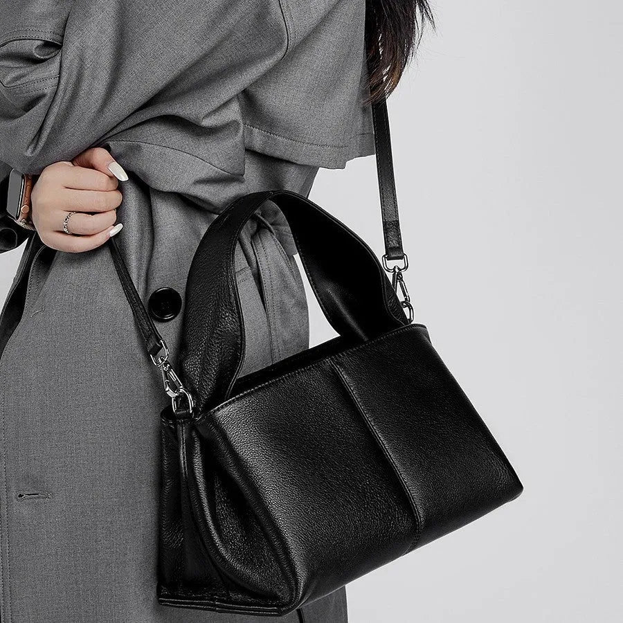 Genuine cowhide leather messenger bag in urban style with sandwich pocket and double straps.