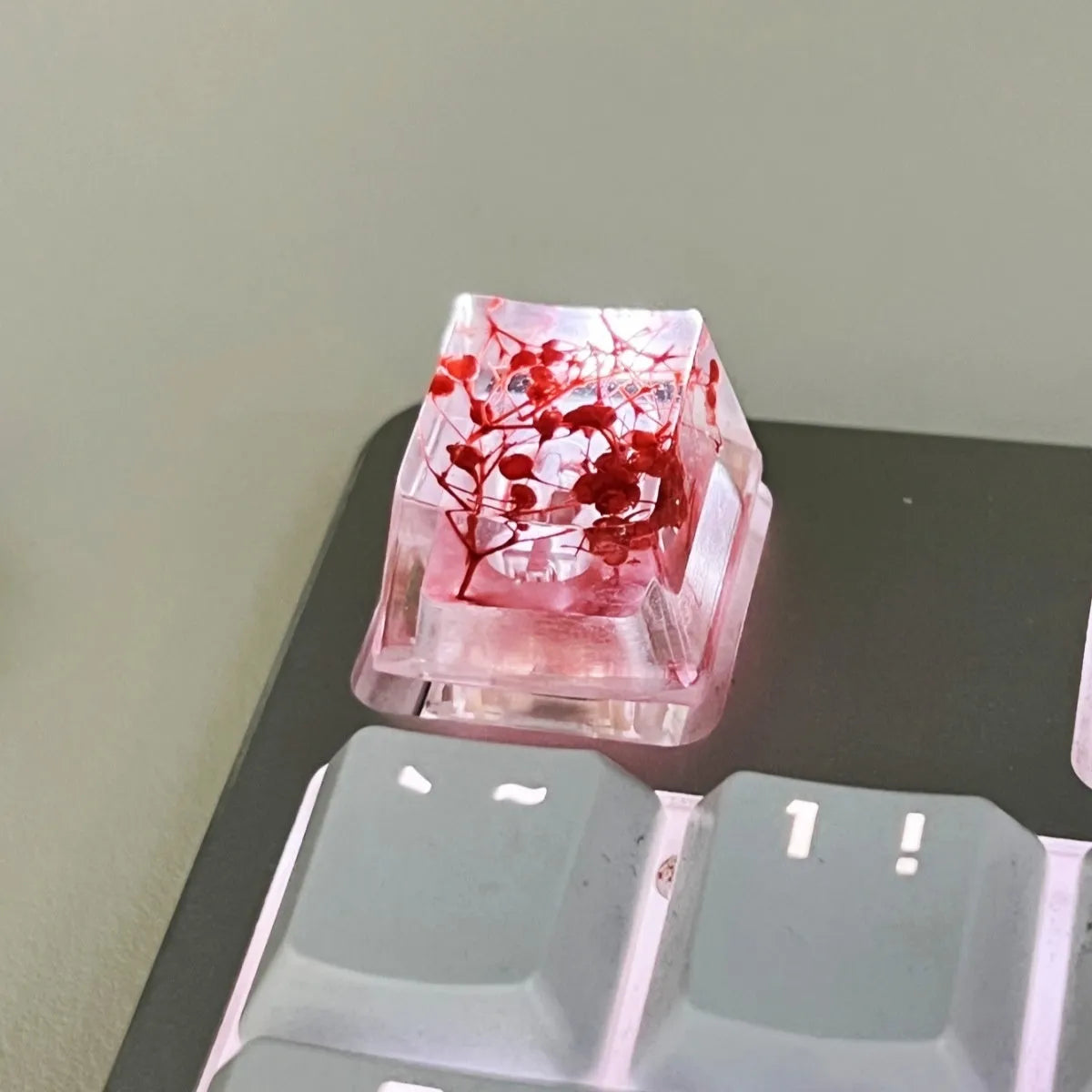 High-transparency starry sky design resin artisan keycap for mechanical keyboards, shown in green colour.