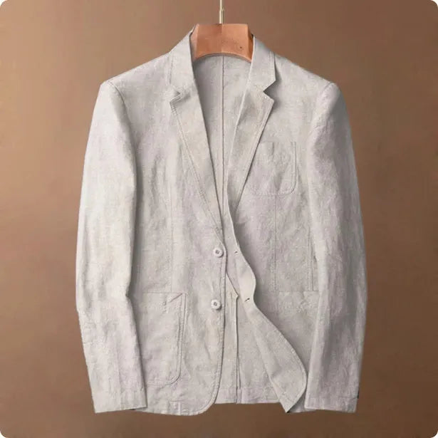 Men's thin linen suit coat in a solid colour on a hanger, showing stick pocket detail.