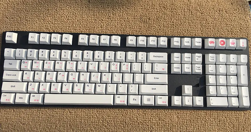 Set of PBT keyboard keycaps with Japanese, Russian, and Korean thermal sublimation legends, showing a five-sided spacebar.