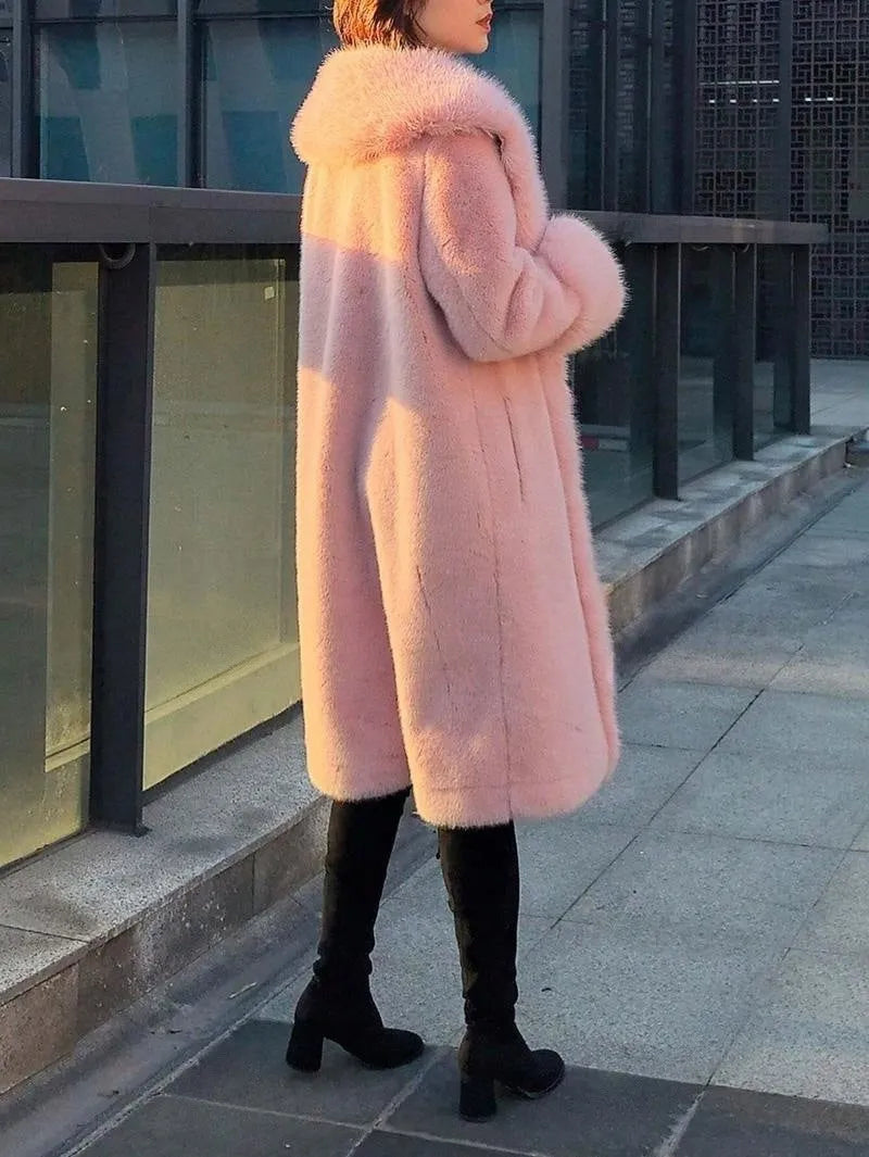 A grey women's mid-length faux fur coat with a thick collar, shown on a hanger.