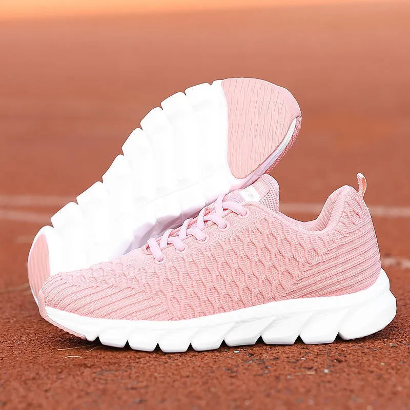 Women's running shoes showing fly weaving upper material and wear-resistant outsole in black, pink, or white colour options